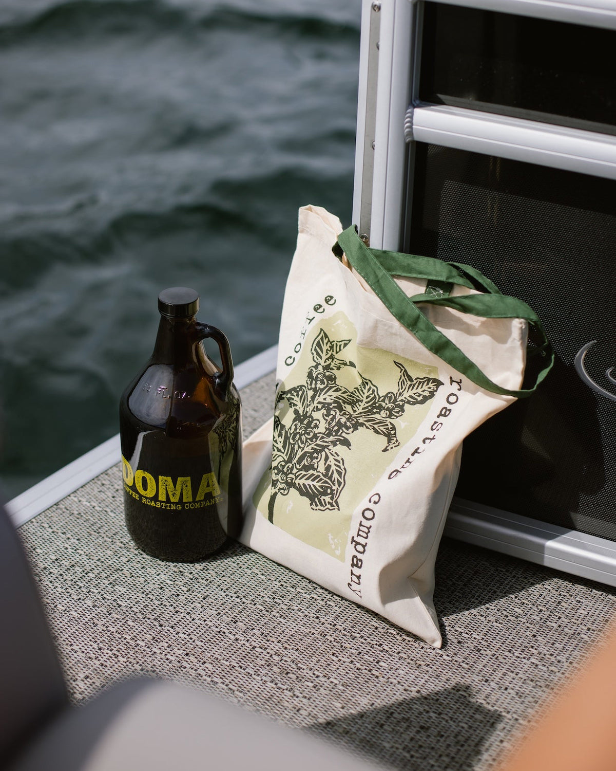 DOMA tote bag on a boat on the lake